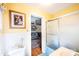 Bright bathroom featuring tile flooring, shower with sliding glass doors, and view into living room at 1213 10Th Street Nw Ln # 3, Hickory, NC 28601
