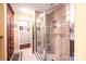 Bathroom featuring a tiled shower with a glass door and a small seating bench at 1213 10Th Street Nw Ln # 3, Hickory, NC 28601