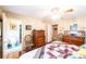 Well-lit bedroom features floral wallpaper, hardwood floors, and ensuite bathroom at 1213 10Th Street Nw Ln # 3, Hickory, NC 28601