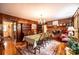 Formal dining room with vintage decor, wood paneling and brick fireplace at 1213 10Th Street Nw Ln # 3, Hickory, NC 28601