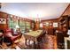 Formal dining room with wood paneling, natural light, and vintage decor at 1213 10Th Street Nw Ln # 3, Hickory, NC 28601