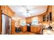 Well-lit kitchen featuring wood cabinets and stainless steel refrigerator at 1213 10Th Street Nw Ln # 3, Hickory, NC 28601