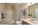 Neutral bathroom features a shower-tub combo, a toilet and vanity, and a framed cow wall art at 127 Way Cross Ln, Troutman, NC 28166
