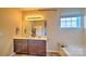 The bright bathroom features double sinks, and a separate tub, offering a spa-like experience at 127 Way Cross Ln, Troutman, NC 28166