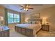 Bedroom featuring neutral walls, and large windows that offers great views at 127 Way Cross Ln, Troutman, NC 28166
