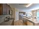 Gourmet kitchen with stainless steel appliances, granite counters, and dark cabinets, perfect for cooking at 127 Way Cross Ln, Troutman, NC 28166