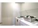 The bright laundry room has modern washer and dryer appliances and overhead shelving at 127 Way Cross Ln, Troutman, NC 28166