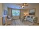 Comfortable living room featuring neutral tones, ample natural light, and ceiling fan at 127 Way Cross Ln, Troutman, NC 28166