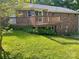 A spacious wooden deck in the backyard of a brick home, perfect for outdoor enjoyment at 1300 Irish Potato Rd, Concord, NC 28025