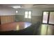 Bright finished basement with wood-look flooring, offering flexible space for recreation and relaxation at 1300 Irish Potato Rd, Concord, NC 28025