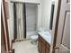 Full bathroom features a vanity, toilet, tub/shower combo with decorative curtain at 1300 Irish Potato Rd, Concord, NC 28025