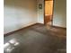 Carpeted bedroom with a connecting bathroom offering ample space at 1300 Irish Potato Rd, Concord, NC 28025