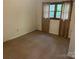 Inviting bedroom featuring a window with curtains, providing both light and privacy to the space at 1300 Irish Potato Rd, Concord, NC 28025