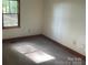 A cozy bedroom with natural light streaming through the window, creating a warm and inviting atmosphere at 1300 Irish Potato Rd, Concord, NC 28025