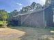 Brick home featuring a wooden deck at 1300 Irish Potato Rd, Concord, NC 28025