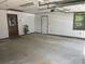 Spacious garage interior featuring white walls and natural light at 1300 Irish Potato Rd, Concord, NC 28025