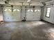 Large garage featuring two doors and a window at 1300 Irish Potato Rd, Concord, NC 28025