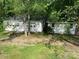 White one-story garage with two garage doors at 1300 Irish Potato Rd, Concord, NC 28025