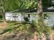 White one-story garage with grass in the front at 1300 Irish Potato Rd, Concord, NC 28025
