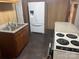 Cozy kitchen with a refrigerator and dark wood cabinetry at 1300 Irish Potato Rd, Concord, NC 28025