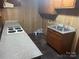 Compact kitchen with laminate floors and countertops at 1300 Irish Potato Rd, Concord, NC 28025