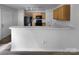 Kitchen view showcasing bright countertops, wooden cabinetry, and modern appliances at 1325 Crandon Dr, Charlotte, NC 28216
