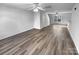 Spacious open floor plan with luxury vinyl plank flooring and neutral paint at 1325 Crandon Dr, Charlotte, NC 28216