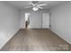 Main bedroom features neutral carpet, ceiling fan, and ample closet space at 1325 Crandon Dr, Charlotte, NC 28216