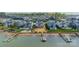 Breathtaking aerial shot of lakefront homes featuring private docks and pristine sandy beaches at 139 Little Indian Loop, Mooresville, NC 28117