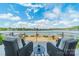 Outdoor balcony showcasing the waterfront view with comfortable seating to relax and enjoy the scenery at 139 Little Indian Loop, Mooresville, NC 28117