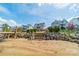 Picturesque view of steps leading from the beach up to well-maintained homes, creating an idyllic waterfront setting at 139 Little Indian Loop, Mooresville, NC 28117