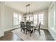 Elegant dining room with modern lighting, large windows, and views of the lake, perfect for Gathering gatherings at 139 Little Indian Loop, Mooresville, NC 28117