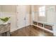 Functional entryway with coat hooks, bench seating, and woven basket storage at 139 Little Indian Loop, Mooresville, NC 28117