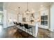 Bright kitchen with a large kitchen island, stainless steel appliances, and modern lighting fixtures, perfect for cooking at 139 Little Indian Loop, Mooresville, NC 28117