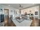 Spacious open-concept living room with hardwood floors, and access to the staircase and kitchen, great for Gathering gatherings at 139 Little Indian Loop, Mooresville, NC 28117
