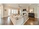 Bright living room with hardwood floors, large windows, and a fireplace, perfect for relaxation and entertaining at 139 Little Indian Loop, Mooresville, NC 28117