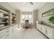 Bright office featuring custom shelving and drawers, with a large window providing ample natural light at 139 Little Indian Loop, Mooresville, NC 28117
