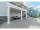Backyard covered patio provides the perfect space to entertain friends and Gathering with shade and ample seating at 139 Little Indian Loop, Mooresville, NC 28117