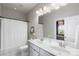 Bright bathroom with double sink vanity, framed mirror, and shower/tub combination at 1519 Cedar Park Dr, Pineville, NC 28134