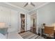 Bright bedroom with hardwood floors featuring a walk-in closet and an ensuite bathroom at 1519 Cedar Park Dr, Pineville, NC 28134