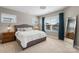 Light-filled bedroom with soft carpet, window treatments, a comfortable bed, and tasteful decor at 1519 Cedar Park Dr, Pineville, NC 28134
