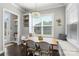 Cozy breakfast nook with corner seating and a view to the backyard at 1519 Cedar Park Dr, Pineville, NC 28134