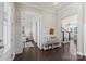 Bright foyer with wainscoting, a bench, and access to the living areas at 1519 Cedar Park Dr, Pineville, NC 28134