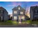 Charming two-story home with a well-manicured front yard and inviting curb appeal at 1519 Cedar Park Dr, Pineville, NC 28134