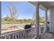 Inviting front porch with white railing overlooking the manicured yard at 1519 Cedar Park Dr, Pineville, NC 28134