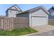 Detached two-car garage with a private fenced yard and fresh landscaping at 1519 Cedar Park Dr, Pineville, NC 28134