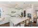 Elegant white kitchen with stainless steel appliances and a large center island at 1519 Cedar Park Dr, Pineville, NC 28134