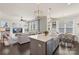 Bright, open kitchen flowing into the living area, featuring a large island and modern appliances at 1519 Cedar Park Dr, Pineville, NC 28134