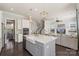 Open kitchen featuring an island with a farmhouse sink, pendant lighting, and stainless steel appliances at 1519 Cedar Park Dr, Pineville, NC 28134