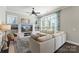 Bright living room showcasing built-in shelving, a comfortable sofa, and ample natural light at 1519 Cedar Park Dr, Pineville, NC 28134